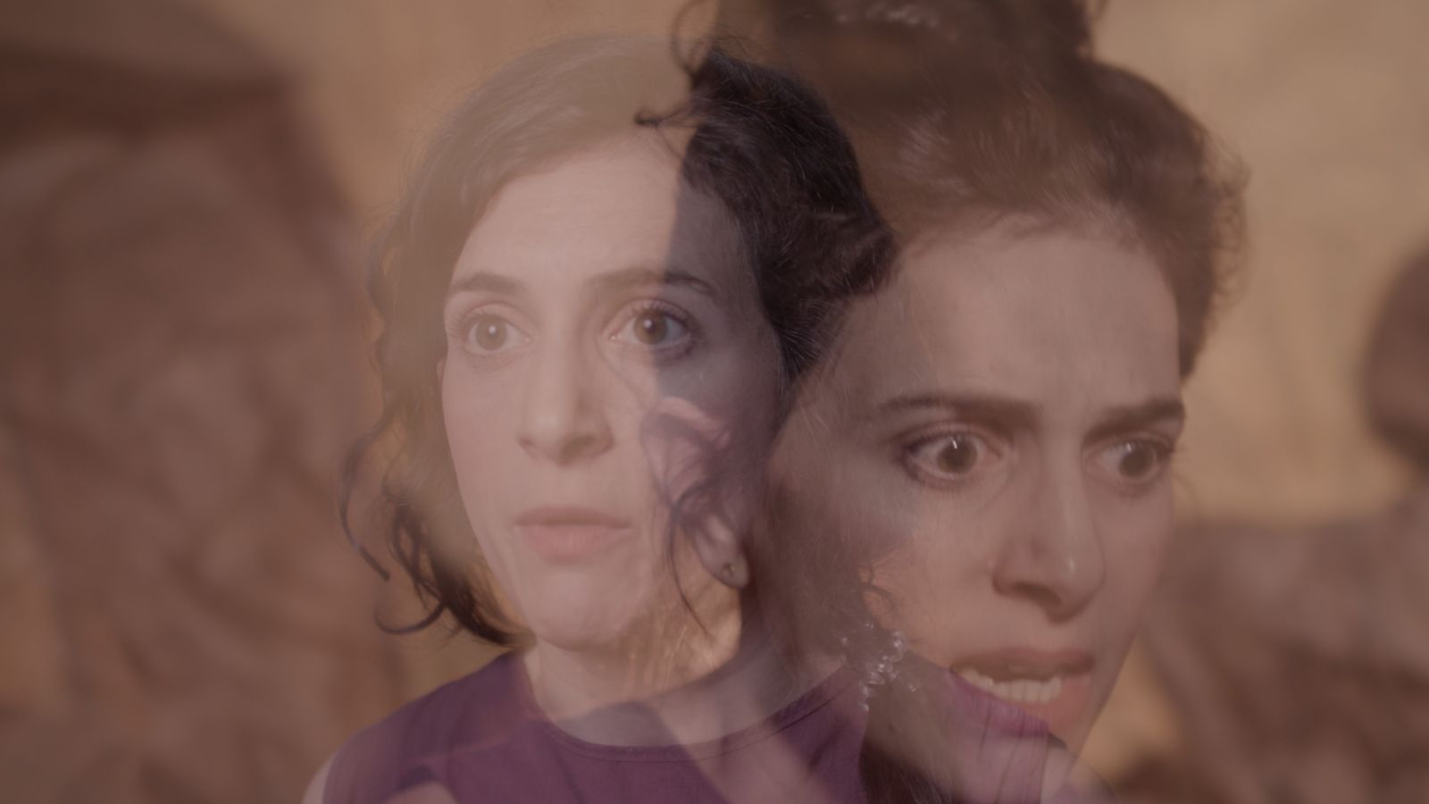 A woman with short, curly dark hair stares beyond the camera; this image is overlaid with another image of the same woman looking down and to the left