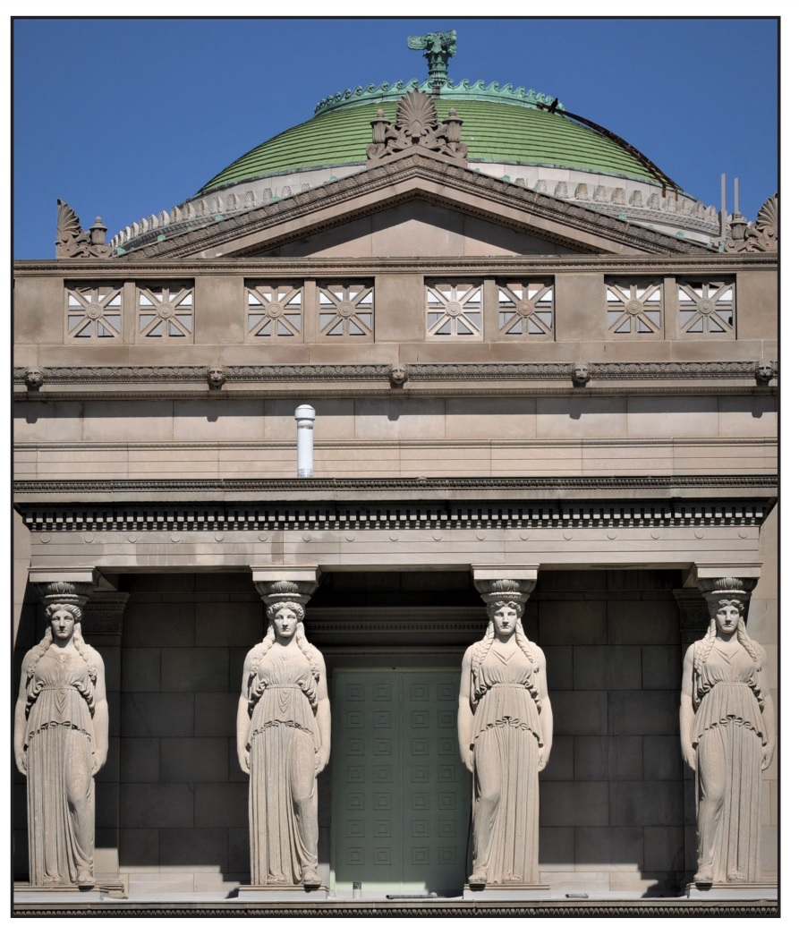 Four stone columns in the shape of women dressed in drapery stand at the front of a stone building with a green, domed roof.